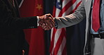 People, handshake and flag of country at election for respect, political agreement and alliance. Men, shaking hands and deal for diplomacy, international negotiation and peace gesture with government