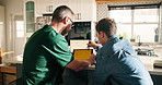 Distance learning, study or tablet with father and son in kitchen for homeschooling or lesson. App, education or teaching with single parent man and boy student in apartment for development from back