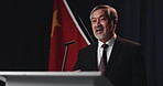 Announcement, man and politician on stage for election, microphone or conference with feedback. Mature person, presentation or speaker with mic, democracy or public speaking with speech or convention
