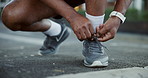 Person, hands and tying with shoes for fitness, workout preparation or outdoor exercise. Closeup, active or runner tie sneakers with laces for physical training, cardio or run on city street or road
