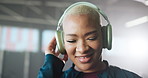 Headphones, fitness and woman in gym, smile and listening to music, sound and motivation. Person, headset and athlete in health center, happiness and audio with exercise, radio and energy with app