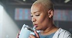 Drinking, water and woman in gym, wellness and break with liquid for fitness, morning and hydration. Thirsty, athlete or black person with beverage for body temperature, fluid or nutrition for health