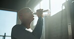 Drinking, water and woman in gym, morning and break with liquid for fitness, hydration and wellness. Thirsty, athlete or black person with beverage for body temperature, fluid or nutrition for health
