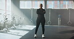 Arms crossed, face and black person in gym for development, training or workout class. Challenge, fitness and serious with non binary athlete in exercise studio for improvement, sports or wellness