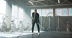 Fitness, woman and workout with battle ropes at gym for power training, resilience and endurance. Health, athlete and weight equipment for intense challenge, functional exercise or muscle development
