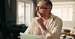 Home, thinking and man with tablet, planning for debt and savings with solution, internet and choice. Tech, apartment or mature person with decision, budget report or investment with insurance policy
