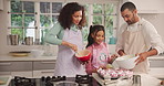 Parents, girl and cupcake ingredients in kitchen, skills and smile with help for baking at home. People, mother and daughter with father, happy or learning with muffins for bonding in family house