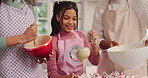 Girl, baking and cupcake batter with parents in kitchen, mixing and pour ingredients at family home. Child, mother and father with teaching skills, guide and help with smile for muffins at apartment
