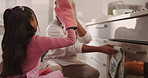 Man, daughter and cupcake in oven for baking, high five for motivation or support with bonding in home. Dad, girl kid and partners for fresh baked goods with gesture for dessert success in kitchen