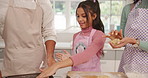 Girl, baking and cookies with parents in kitchen, mixing and tray for ingredients at family house. Child, mother and father with teaching skills, bonding or help with smile for biscuit dough at home