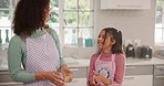 Funny, baking and mother in kitchen, girl and bonding together with smile, ingredients and laugh. Home, parent and mama with daughter, happiness and learning with help, child development and recipe