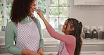Baking, mother and child with flour on nose for playing, learning and family bonding together. Home, mom and cooking with kid for game with love, funny and happy parent laugh with daughter in kitchen