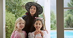 Face, halloween and mother with happy children in home for holiday celebration. Mom, basket and kids together for trick or treat with girls, parent or talk with costume with family portrait at door
