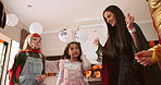 Halloween, dance and parents with children in home for celebration, bonding and fun together. Below, family and excited mom, dad and kids with music for holiday, costume party and festive tradition