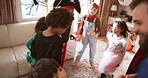 Halloween, dance and family with kids in home for celebration, bonding and fun together. October, parents and excited mom, dad and children with music for holiday, costume party and festive tradition