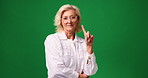 Face, finger and woman in studio, no and disciplinary teacher on green background. Portrait, senior person and educator with strict rules, deny and serious with decline, reaction and rejection