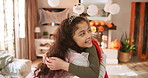Halloween, hug and smile of children in living room of home for celebration, holiday or tradition. Costume, excited and love with friends embracing in apartment together for trick or treat season