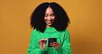 Phone, research and woman in studio with communication, networking or contact on mobile app. Technology, reading and person with cellphone for connectivity, texting or chatting by yellow background.