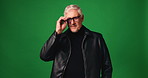 Man, glasses and eye care with face in studio, smile or confident with mockup space on green background. Mature person, spectacles and happy for vision, optometry and prescription lens in Portugal