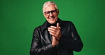 Applause, glasses and face of man in studio for celebration, good news and congratulation. Support, announcement and prize with mature person on green background space for clapping hands and praise