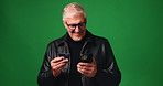 Mature man, credit card and banking with phone in studio for payment on a green background. Male person, shopper or model with smile on mobile smartphone for ecommerce or online shopping on space
