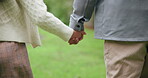 Person, kid and holding hands for walk outdoor with love, travel journey and bonding together. Parent, child and trust with support of holiday adventure, trekking guidance and helping on getaway trip