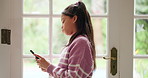 Mental health, sad or kid with phone in home for cyberbullying, depression or social media addiction. Text, girl and unhappy child with mobile for cyber stalker, reading message and anxiety in house