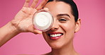Studio background, face and woman with cream, skincare and hydration of healthy skin or moisturizer. Happy, person and facial treatment with lotion, shine and cosmetics for antiaging benefits or glow