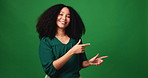 Happy woman, face and pointing with presentation in studio for advertising on a green background. Portrait, female person or model with smile or showing list for marketing or option on mockup space