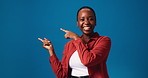 Happy, black woman and pointing with marketing in studio for advertising on a blue background. Portrait, female person or model with smile or showing list for selection or options on mockup space
