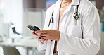Hands, doctor and phone for typing with communication, medical advice and Telehealth app at clinic. Technology, woman and healthcare worker online for connection, website and search in hospital