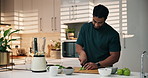 Man, fruit and smoothie in home kitchen with apples and healthy ingredients for protein and wellness. Bodybuilder, diet and blender for shake drink, breakfast or weight gain with time lapse in house