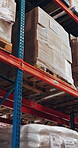 Empty, warehouse and goods on shelf, logistics and stock for supply chain, shipping or distribution. Commercial building, production and merchandise boxes for import, storage and package in factory