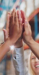 High five, teamwork and shipping with hands of people in warehouse for logistics success, celebration and support. Supply chain achievement, mission and synergy with employees in export factory