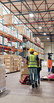 Back, supply chain and people in warehouse, pull pallet and teamwork with distribution. Employees, man or woman in factory, trolley or package with manufacturing, global shipping company or inventory