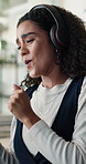 Dancing, woman and happy with headphones, office or listening to music, employee and streaming song. Online, audio and person with tech for fun in business, smile and rhythm with playlist or radio