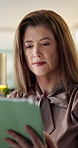 Tablet, reading and businesswoman in office with research for finance report with company budget. Corporate, digital technology and mature female financial manager with email for investment proposal.