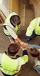 Above, hands stack and people in factory, logistics and team building with distribution. Men, women and happy employees in warehouse, gesture and support with target, supply chain and achievement