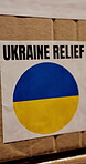 Ukraine, charity and donation box with aid for famine relief, crisis response and humanitarian help. NGO support, outreach and cardboard package for social responsibility and community service parcel