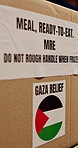 Palestine, donation and charity box with shipping for war relief, crisis response and food package. Logistics, MRE and caution label on parcel for humanitarian aid, Gaza outreach and NGO distribution