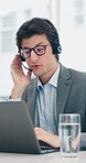Headset, laptop and support with man in call center for financial advice or virtual assistance. Computer, consulting and customer service with bank employee in office for communication or finance