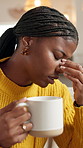 African woman, headache and coffee at house for stress, mental health and burnout symptoms. Tired, sick and female person with herbal tea for migraine, brain fog and vertigo pain with recovery drink