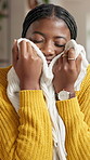 Smelling, laundry and black woman in apartment for housekeeping, maintenance or spring cleaning. Happy, fabric and African female person with scent on material of clothes in living room at home.
