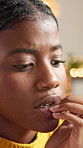Thinking, woman and bite nails at house for depression, psychology grief and trauma reflection. African person, bad habit and mental health of negative memory, coping mechanism and loneliness phobia
