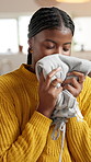Woman, relax and smell laundry at house for clean clothes, fabric fragrance and housekeeping. African person, folding and breathe scent of garment, fresh aroma and apparel hygiene of housework chores