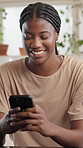 Black woman, texting or laugh with phone in home for funny message, social media meme and relax. Happy, person and smartphone in apartment for online joke, comic notification and internet connection