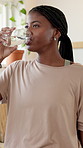 Black woman, drinking and water with medication in home for healthcare, symptoms or side effects. Female person, antibiotic and hydration with glass or pill for medical cure, vitamins or wellness