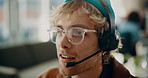 Businessman, consultant and discussion with headset in call center office for online advice. Happy man, employee or agent with smile or mic for support, virtual assistance or remote help in workplace