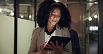 Walking, night and business woman on tablet for research, project review and online proposal. Professional, working late and person on tech for reading feedback, digital report and website in office
