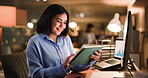 Dark, tablet and business woman in office for financial review, online trading and investment. Professional, night and person with graph on tech for finance proposal, budget report or stocks research